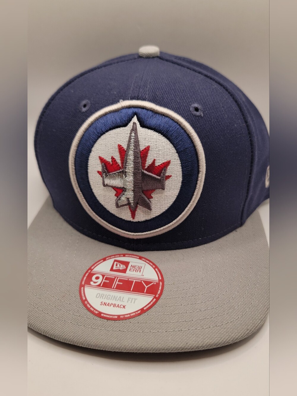 New Era Men’s Winnipeg Jets Navy & Gray Snapback Hat